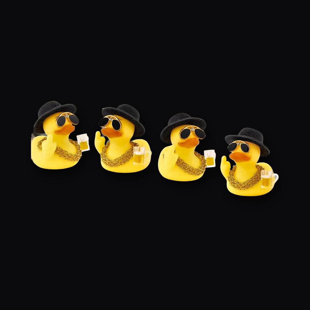 Four Boss Ducks lined up on a car dashboard