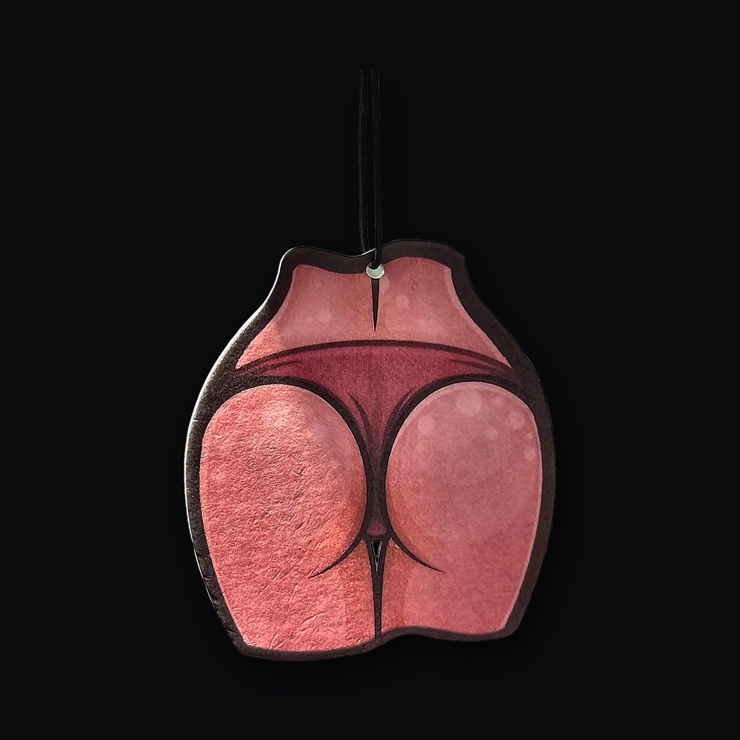 Peach Air Freshener hanging from a rear view mirror in a car