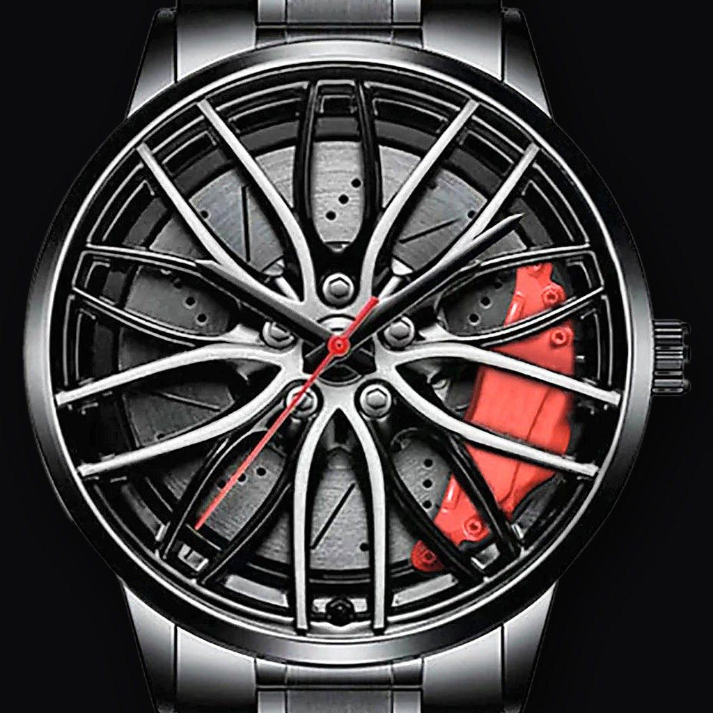 Wheel dial closeup, mesh spokes over printed brake disc and red calliper