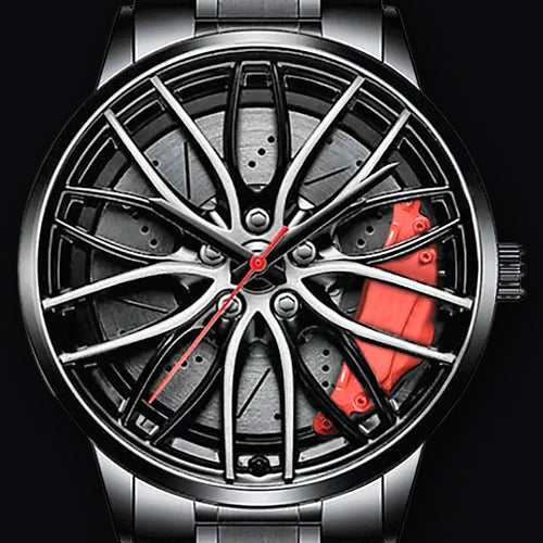 Wheel dial closeup, mesh spokes over printed brake disc and red calliper