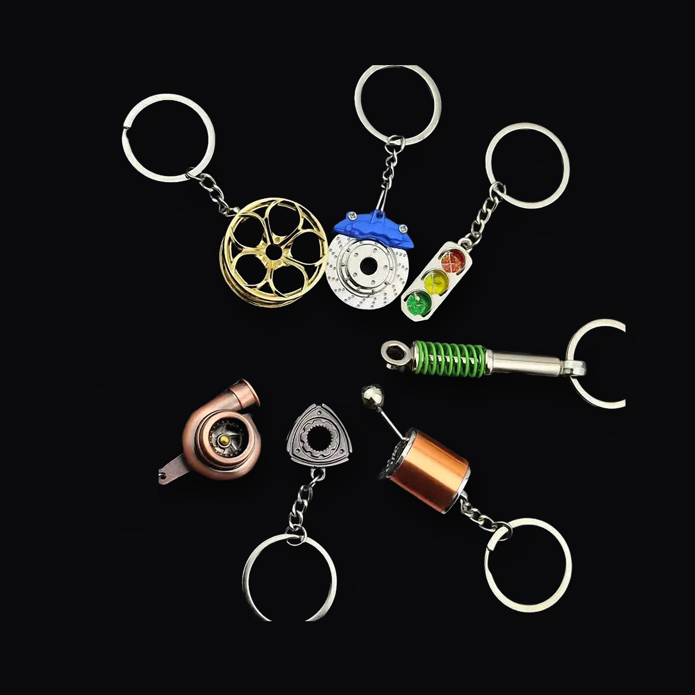 Parts Keyring, group of miniature car part keyrings on black