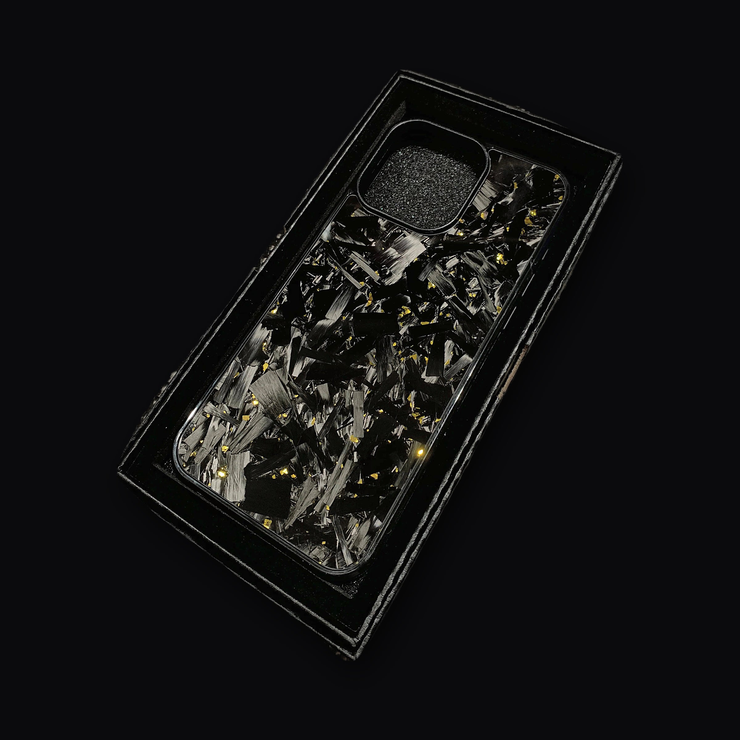 Forged carbon case angled to show the depth of the resin