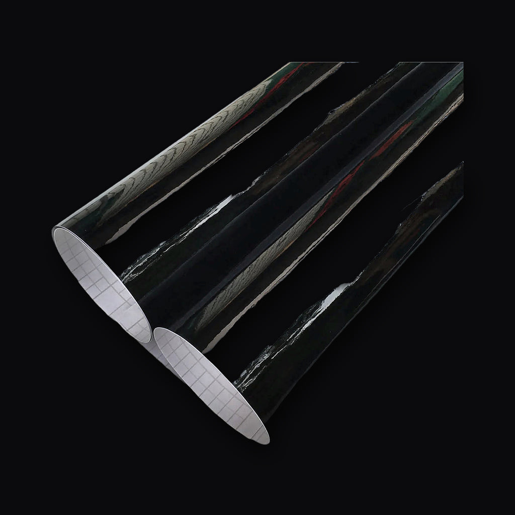 Gloss black wrap film unrolled showing the reflective surface