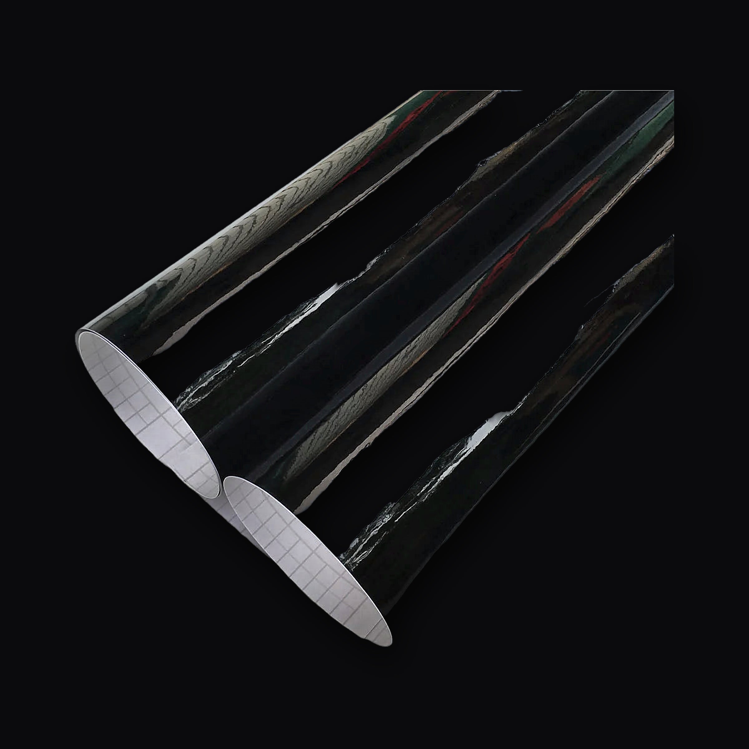 Gloss black wrap film unrolled showing the reflective surface