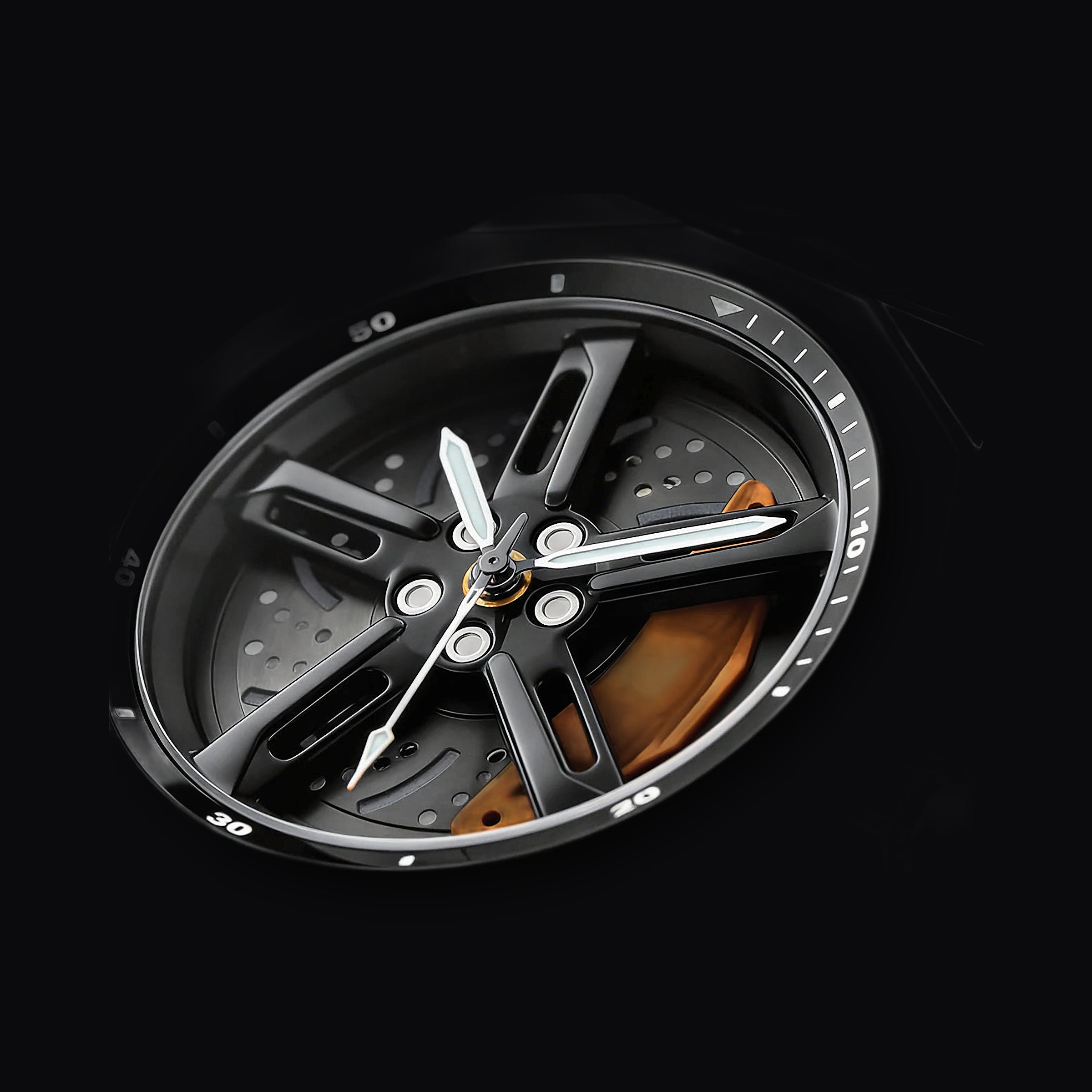 Close detail of the orange brake caliper on the Apex Chrono dial
